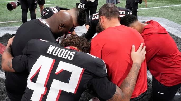 Lions and Falcons Unite in Prayer After Morice Norris Suffers Serious Injury